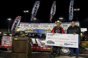 Morgan Bagley in the #14m celebrates after winning the Port-A-Cool® Texas World Dirt Track Championships in the SUPR Late Model series on March 8, 2014 in Fort Worth, Texas. (Photo by Cooper Neill/Getty Images for Texas Motor Speedway) 