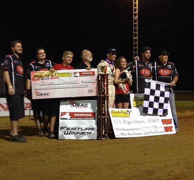 Noblesville, Indiana's Bryan Clauson (middle) and the RKR/Curb-Agajanian crew celebrate Thursday night's "Indiana Midget Week" USAC Honda National Midget feature win at Lincoln Park Speedway in Putnamville, Indiana.