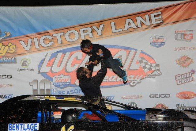 Justin Russell, with son Blaine, after a victory during the 2015 season. - Photo by CB Race Photos