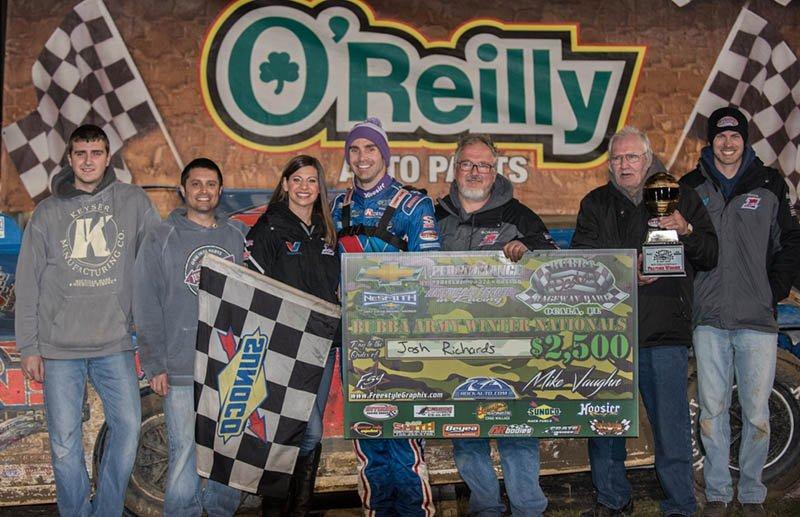 Josh Richards of Shinnston, WV celebrates with his crew after his first career NeSmith Chevrolet Dirt Late Model Series win on Friday night at Bubba Raceway Park in Ocala, FL driving the Sallack Well Service Rocket.  Richards took the lead on lap five, and then held off a strong challenge from Kyle Bronson of Brandon, FL to post the victory.  (NeSmith Media Photo by Bruce Carroll)