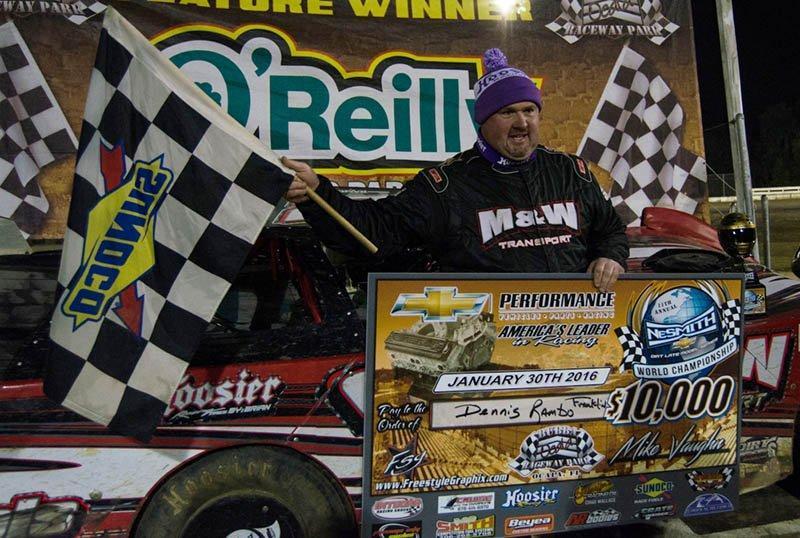 Dennis “Rambo” Franklin of Gaffney, SC holds the $10,000 check after winning the 100-lap 11th Annual World Championship Race for the NeSmith Chevrolet Dirt Late Model Series driving the M&W Transportation Special on Saturday night at Bubba Raceway Park in Ocala, FL.  Franklin had been trying for ten years to win the race, only to have something go wrong while leading.  The driver known as Rambo made a statement by leading 75 of the 100 laps and lapping all but the second and third-place cars.  He even held off a hard-charging Kyle Bronson of Brandon, FL in the last 11 laps of the race, after Bronson made a strategic move that should have left Franklin a sitting duck.  (NeSmith Media Photo by Bruce Carroll)  